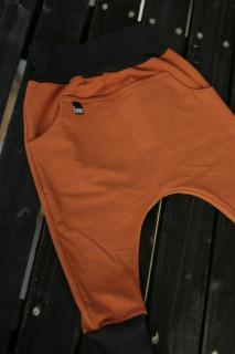 Kalhoty z teplákoviny Barva/materiál: Rezavá, Velikost: 1-2 roky