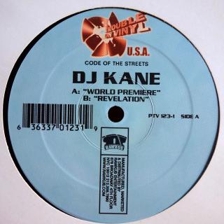 12  DJ Kane ‎– World Premiere / Revelation (Deska mírně ohraná s jemnými vlásenkami. Hraje fajn. Obal lehce obnošený.)