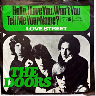 7  The Doors – Hello, I Love You, Won't You Tell Me Your Name? (Deska je ohraná s mnoha vlásenkami i několika povrchovými oděrkami. Hraje stále velmi dobře s mírným praskotem v tichých pasážích. Obal je trochu obnošený a pokrčený s natrhnutou hranou viz f