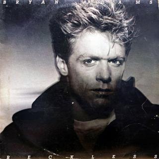 LP Bryan Adams ‎– Reckless (Deska je mírně ohraná s mnoha vlásenkami, mírný praskot v tichých pasážích. Obal má oděrky na hranách, ale potisk je z obou stran pěkný. Orig. vnitřní obal s potiskem.)