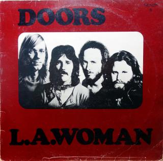 LP Doors ‎– L.A. Woman (Deska je trochu ohraná, vlásenky i jemné povrchové oděrky. Zvuk je stále velmi dobrý s mírným praskotem v celé délce záznamu. Obal taky trochu obnošený, lehce obroušené hrany.)