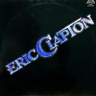 LP Eric Clapton ‎– Eric Clapton (Deska je mírně ohraná s mnoha jemnými vlásenkami. Hraje fajn, dobrý zvuk, mírný praskot v tišších pasážích. Obal je lehce obnošený s drobnými oděrkami na hranách.)