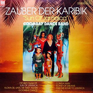 LP Goombay Dance Band ‎– Zauber Der Karibik (Deska je mírně ohraná s vlásenkami. Hraje fajn, velmi dobrý zvuk. Obal má proseknutou hranu cca 7cm, jinak velmi pěkný stav.)