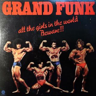 LP Grand Funk ‎– All The Girls In The World Beware !!! (Včetně kresleného insertu. Deska jen mírně ohraná, jemné vlásenky. Obal také jen lehce obnošený)