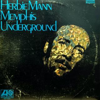 LP Herbie Mann ‎– Memphis Underground (Deska je ohraná, mnoho vlásenek a tři povrchové oděrky. Asi tři minuty je zde slyšet výraznější praskot v záznamu, jinak pouze mírný praskot. Obal je hodně obnošený, hrana spravená páskou viz foto.)