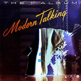 LP Modern Talking ‎– The 1st Album (Deska je hodně ohraná s několika výraznými povrchovými oděrkami + mnoho vlásenek. Nicméně hraje velmi dobře, čistý zvuk, jen mírný šelest mezi skladbami. Obal je v krásném stavu.)