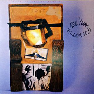 LP Neil Young ‎– Eldorado (Neoficiální vydání. Na hřbetu Cat.No. 25917-1, na desce 25919-1. Dva opticky výraznější škrábance přes první půlku skladby A1. Při pozorném poslechu jsou zde slyšet jemné lupance. Jinak jen jemné vlásenky. Obal ve velmi dobrém s