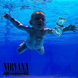 LP Nirvana ‎– Nevermind (Včetně přílohy. Na desce je mnoho jemných vlásenek i tenkých povrchových oděrek. Hraje dobře, jen v tichých pasážích výraznější praskot. Obal je v krásném stavu, pouze lehké stopy používání na lesklém povrchu.)