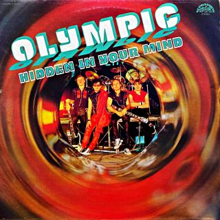 LP Olympic – Hidden In Your Mind (Deska je v pěkném stavu, jen lehce ohraná a jemnými vlásenkami a velmi jemnými povrchovýmo oděrkami. Hraje bezvadně, výborný a čistý zvuk i v tichých pasážích. Obal je lesklý a v perfektní kondici.)