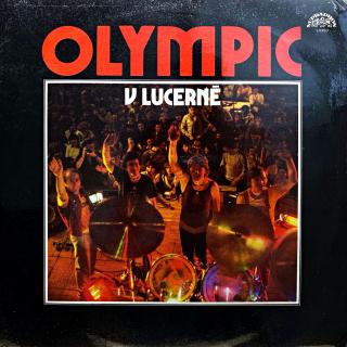 LP Olympic ‎– V Lucerně (Včetně velkého plakátu (formát 6x12 ) s velkou fotkou kapely. Deska, obal i plakát jsou v krásném a lesklém stavu, jen pár velmi jemných vlásenek. Bezvadný a čistý zvuk.)