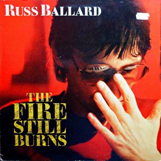 LP Russ Ballard ‎– The Fire Still Burns (Deska v pěkném stavu, pouze jemné vlásenky. Obal má jen drobné oděrky na hranách a cenovku na čelní straně.)