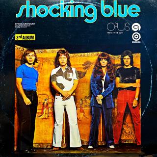 LP Shocking Blue ‎– 3rd Album (Deska je v pěkném stavu, pouze velmi jemné vlásenky. Hraje výborně, čistý zvuk. Obal má vytlačený obrys kotouče a malou stopu od vlhkosti na zadní straně.)