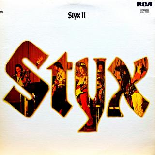 LP Styx – Styx II (Deska je v krásném a lesklém stavu, jen pár jemných vlásenek. Hraje bezvadně, výborný a čistý zvuk, pouze mírný praskot na začátku desky. Obal je taky krásný a lesklý s malou stopou od vlhkosti a průstřelem (import).)