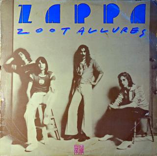 LP Zappa ‎– Zoot Allures (Deska byla hodně hraná. Mnoho vlásenek i povrchových oděrek, nicméně zvuk stále ok. Pouze mírný praskot v záznamu. Obal je obnošený s proseknutým hřbetem.)