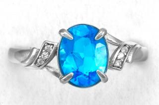 Stříbrný prsten (Ag 925/1000) s broušeným Swiss Blue topazem QAA, vel. kamene cca 10 x 8 mm (TP6657R)