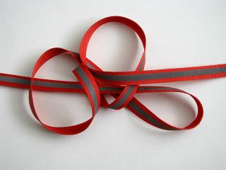 Reflexní páska na červené tkanině - šíře 10 mm