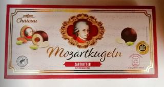 Chateau Mozartkugeln Zartbitter 200g (Pralinky plněné pistáciovým marcipánem (27 %), marcipánem (24 %), lískooříškovým nugátem (14 %) a pokryté mléčnou čokoládou (16 %) a hořkou čokoládou (16 %).)