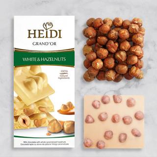Heidi Grand´Or White  Hazelnuts 100g  (Bílá čokoláda a celými karamelizovanými lískovými oříšky a cornflakes)