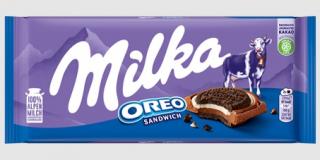 Milka Oreo sandwich 92g (Kakaové sušenky (25%) a mléčná náplň s vanilkovou příchutí (12%) v mléčné čokoládě z alpského mléka (63%).)