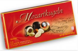 Schluckwerder Mozartovy koule 200 g  (Marcipánové kuličky z pistáciového 30% a mandlového 24% marcipánu, plněné lískooříškovým nugátem 14%, máčené v mléčné 16% a hořké čokoládě 16%. )